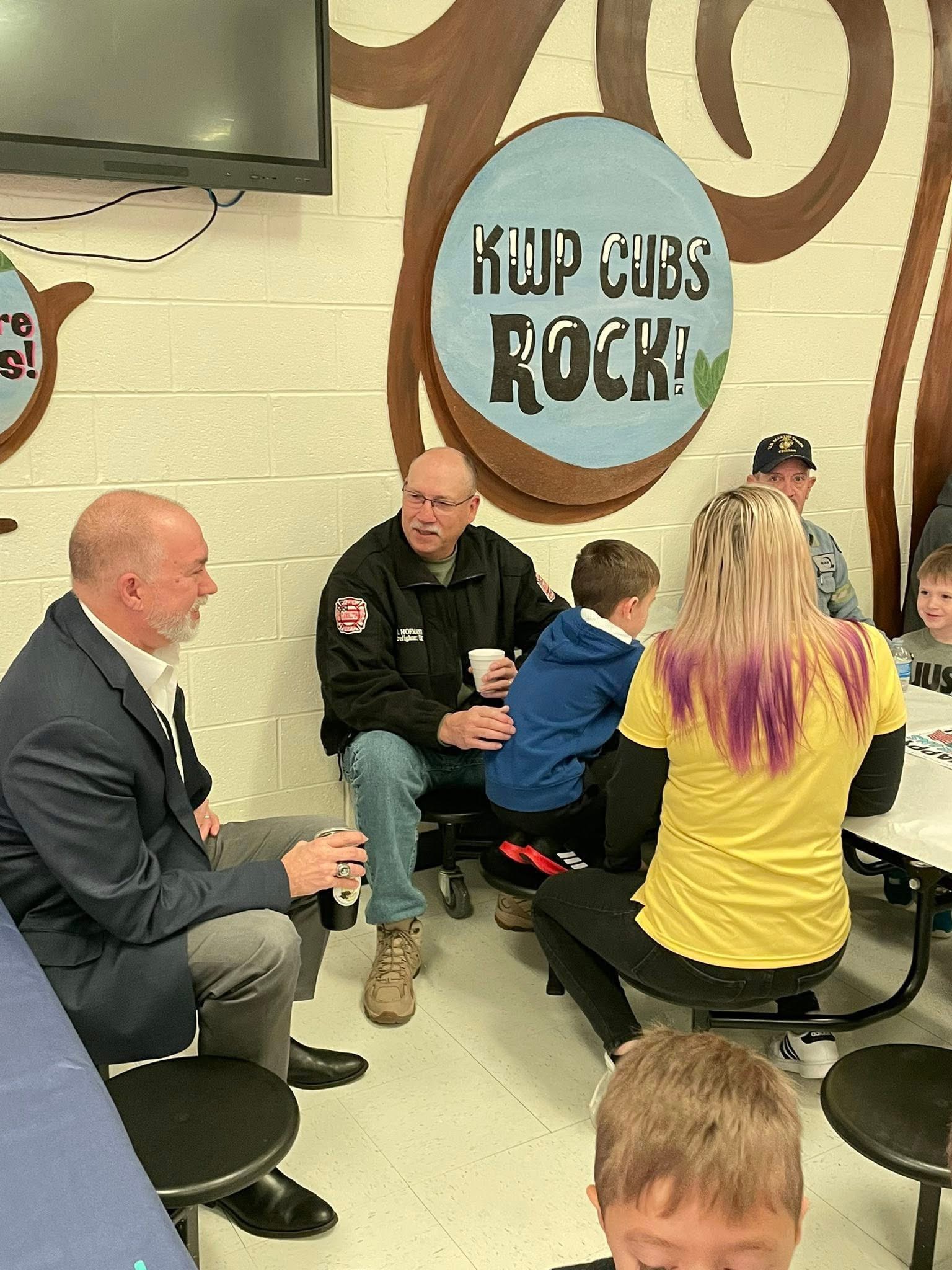 Casey Jaynes visiting with students, families, and first responders at a school event