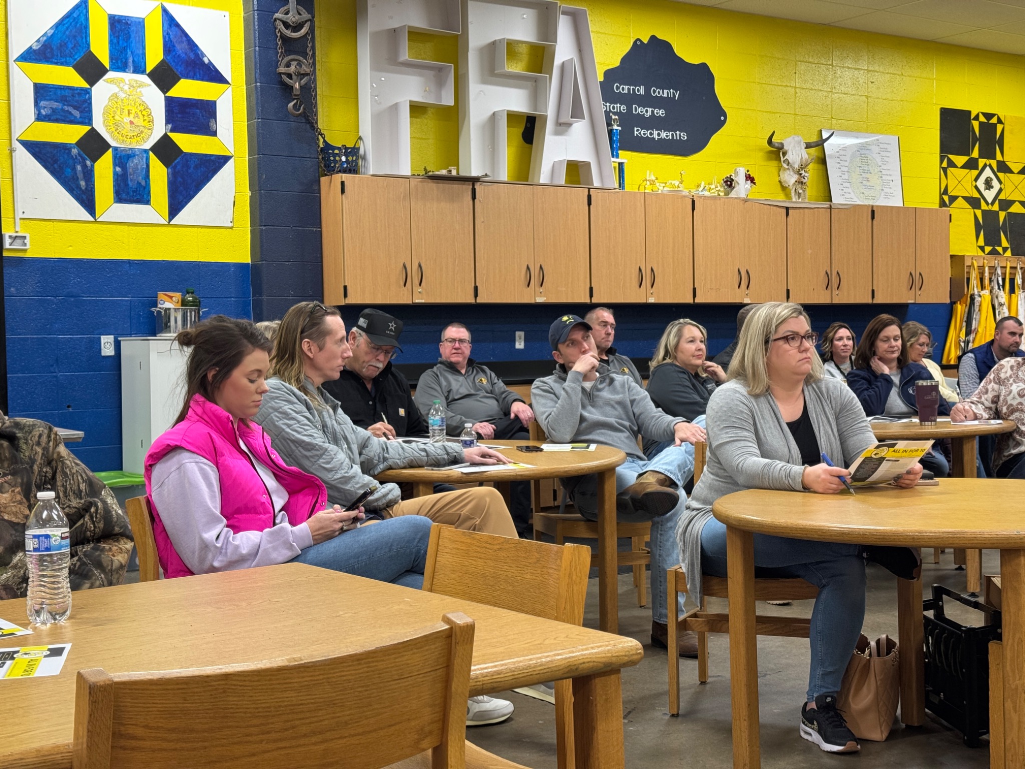 Families and community members participating in a presentation by Casey Jaynes