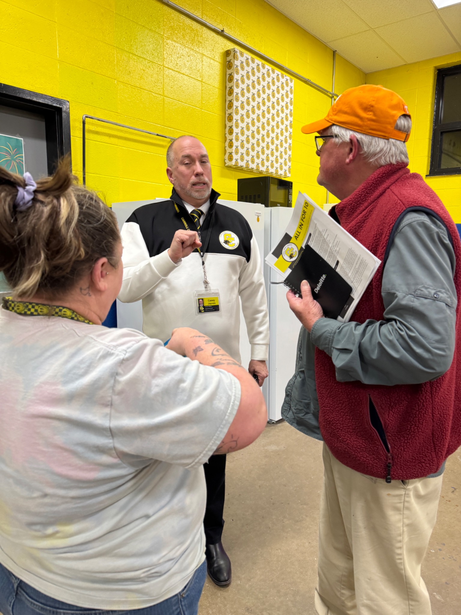 Casey Jaynes speaking with community members after a public presentation